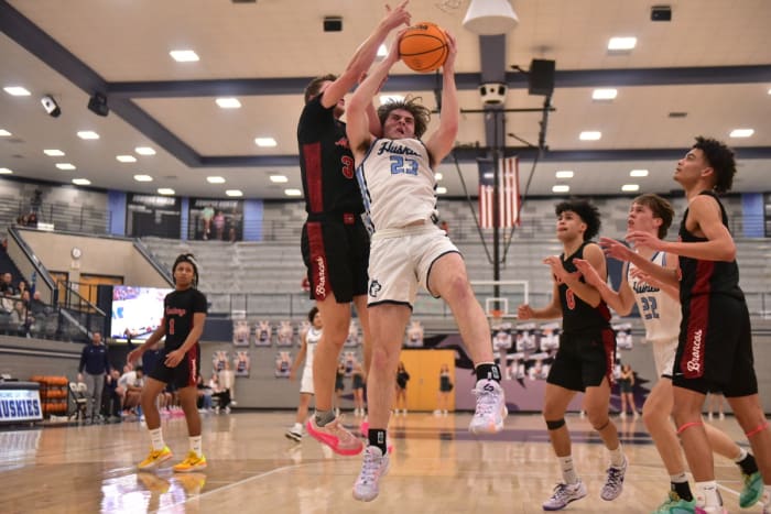 Edmond North senior Dylan Warlick fights for the ball during a recent game. Warlick attempts to lead the Huskies to a third straight Class 6A state title this week.